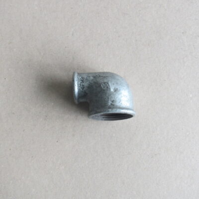 Коляно 1-1/4"х1" вътрешни резби, метално поцинковано